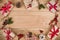 Various Christmas gift boxes and decoration on wooden planks background