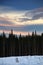 Various clouds on evening sky over winter landscape