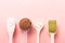 Various collagen powder types on pink background. Plain, matcha, chocolate and pills