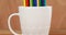 Various color pencil arranged in mug