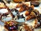 Various colored donuts, topped with chocolate