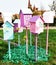 Various colorful bird houses attached to a pole