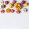 Various colorful little pumpkin and apples on light background. Fall composing with pumpkin