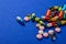 Various colorful scattered medical pills on