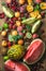 Various colorful tropical fruit selection on rustiv wooden background