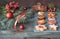 Various cookies with cinnamon sticks, Christmas tree twigs, baubles and berries