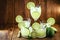 Various cups and doses of caipirinha, typical Brazilian drinks, of lemon, with cachaÃ§a and sugar, on rustic wooden background,