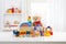 Various cute toys collection on wooden table in children room