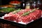 Various cuts of fresh raw red meat in the supermarket, beef, pork, assorted meat steaks on a baking sheet before cooking