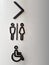 Various Designs of Black Toilet Symbols on Curved Column