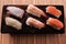 Various different sushi japanese food salmon prawn wood platter