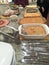 Various dishes and casseroles at a Thanksgiving pot luck