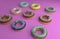 Various donut on pink bckground, 3d rendering .