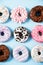 Various donuts on a colorful background. Top view shot.