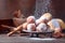 Various donuts powdered with sugar on a brown background