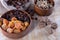 Various dried fruits, apricot, nuts and raisins in a wooden cup