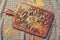 Various dried legumes on chopping board high angle view