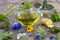 Various dried meadow herbs and herbal tea on old wooden table. fresh medicinal plants and in bundle. Preparing medicinal