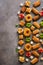 Various Eastern sweets on a rustic brown background. Baklava, delight, cookies. Top view, copy space