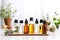 various essential oil bottles arranged on a white table