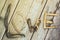 Various figures and letters from driftwood and colored stones on a simple wooden gray background. Top view.