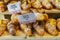 Various flavours of croissant or as in Italy their called brioche on display in a bakery in Milan, Italy with a price and sign - A