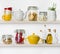 Various food ingredients and utensils on kitchen shelves isolated