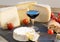 Various french cheeses with glass of red wine