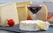 Various french cheeses with glass of red wine