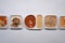 Various frozen meal in plastic tray on white background.