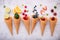 Various of fruits  in cones blueberry ,strawberry ,raspberries and strawberry setup on white stone background . Summer and Sweet