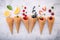 Various of fruits  in cones blueberry ,strawberry ,raspberries and strawberry setup on white stone background . Summer and Sweet