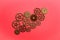 Various gears over red background