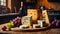 Various gourmet cheeses, fresh grapes on the table in the kitchen products