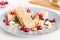 Various granola bars on table background. Cereal granola bars. Superfood breakfast bars with oats, nuts and berries