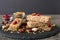 Various granola bars on table background. Cereal granola bars. Superfood breakfast bars with oats, nuts and berries