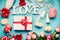 Various greeting LOVE objects : bottle of champagne, gift box, ribbon, flowers, bow, glasses and hearts on light blue desktop, top