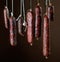 Various hanging salami sausages