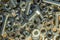 Various hardware. Metal fasteners. Bolts, nuts and washers. Soft focus, abstract, industrial background