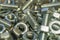 Various hardware. Metal fasteners. Bolts, nuts and washers. Soft focus, abstract, industrial background