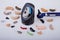 Various hearing aids on white background,