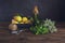 Various herbs, spices, lemons and olive oil on a wooden background