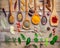 Various herbs and spices in wooden spoons. Flat lay of spices in