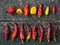 Various hot chilli pepers on the wooden table.