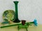 Various items candlestick, metal dog, glass flower and ceramics combined in green