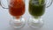 Various juices are poured into two glasses. Electoral focus
