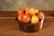 Various juicy and tasty tomatoes in a bowl on the table isolated on blurred background