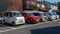 Various Kei cars park in reverse in Arashiyama, Japan. Kei cars will have yellow plate