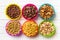 Various kids cereals in colorful bowls