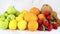 Various kind of fresh and organic fruits ordered on marble background